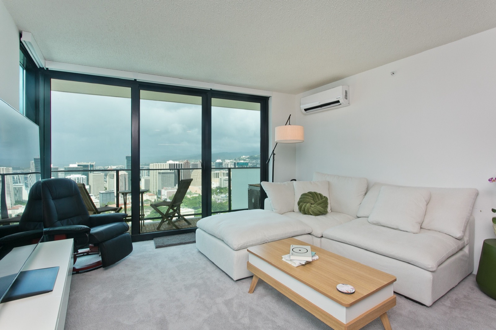 Living room with city and mountain views